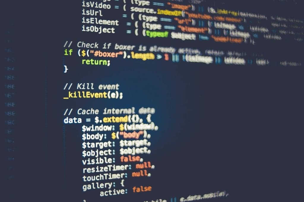 Close-up of source code on a dark editor screen